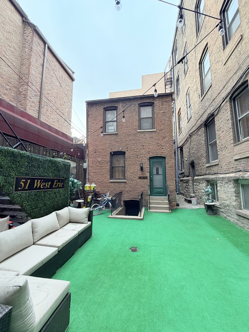 642 North Dearborn Street, Unit CH Chicago, IL 60654 - Photo 1 of 19 a view of a house with a back yard