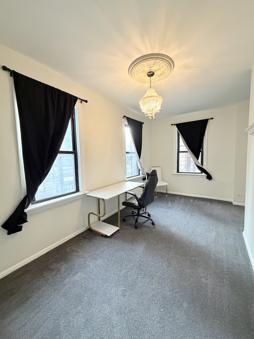 642 North Dearborn Street, Unit CH Chicago, IL 60654 - Photo 14 of 19 wooden floor with table and chairs