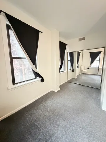 a view of game room with windows