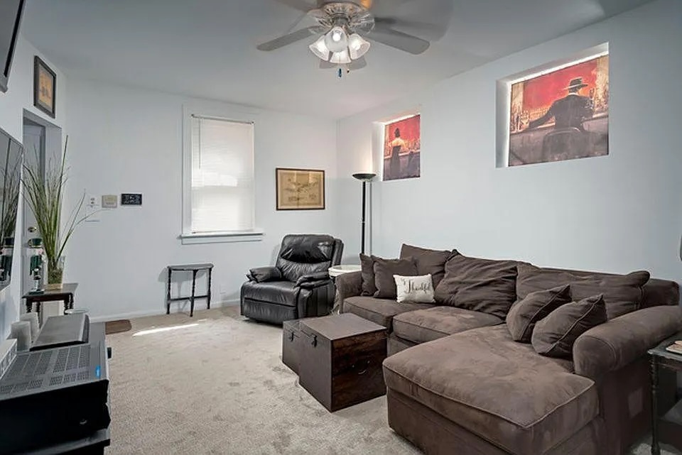 642 North Dearborn Street, Unit CH Chicago, IL 60654 - Photo 5 of 19 a living room with furniture and a chandelier