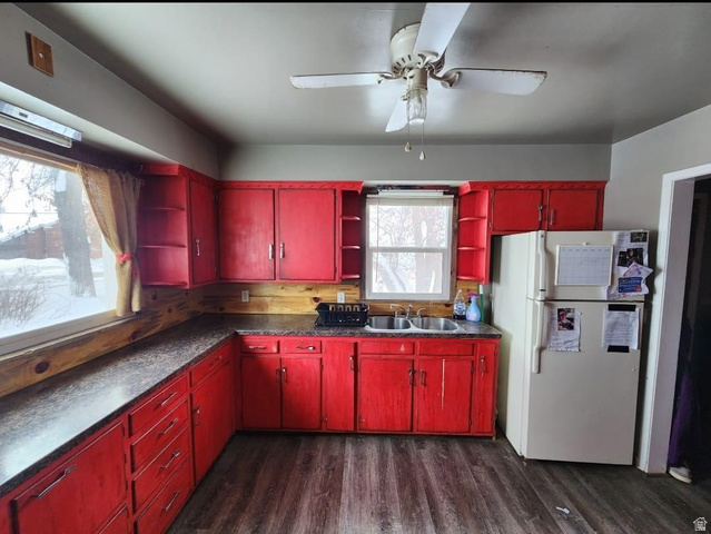 102 South Main Street Paris, ID 83261 - Photo 10 of 33 Kitchen featuring open shelves, freestanding refrigerator, red cabinets, and dark countertops