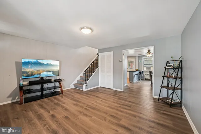 a view of a livingroom with furniture and wooden floor