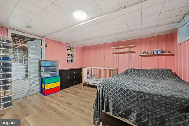 a bedroom with a bed and dresser