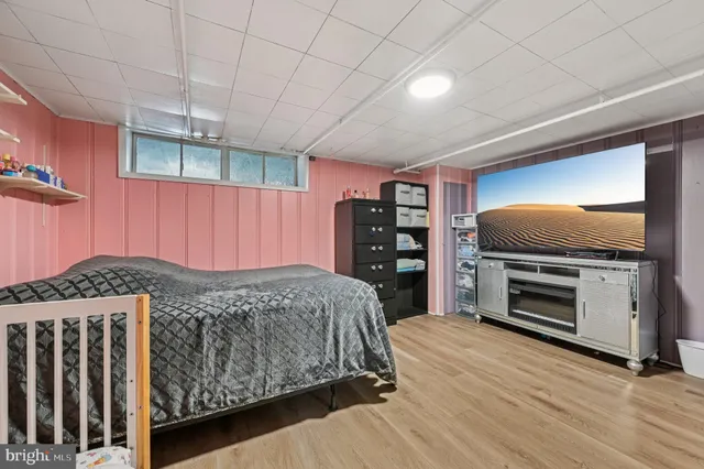 a bedroom with a bed and a fireplace