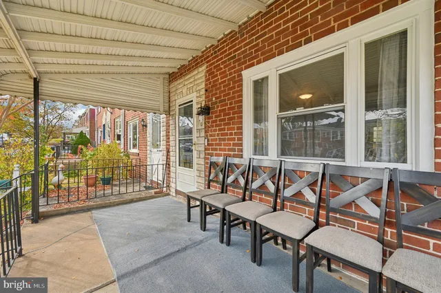 a view of a patio with a couple of chairs