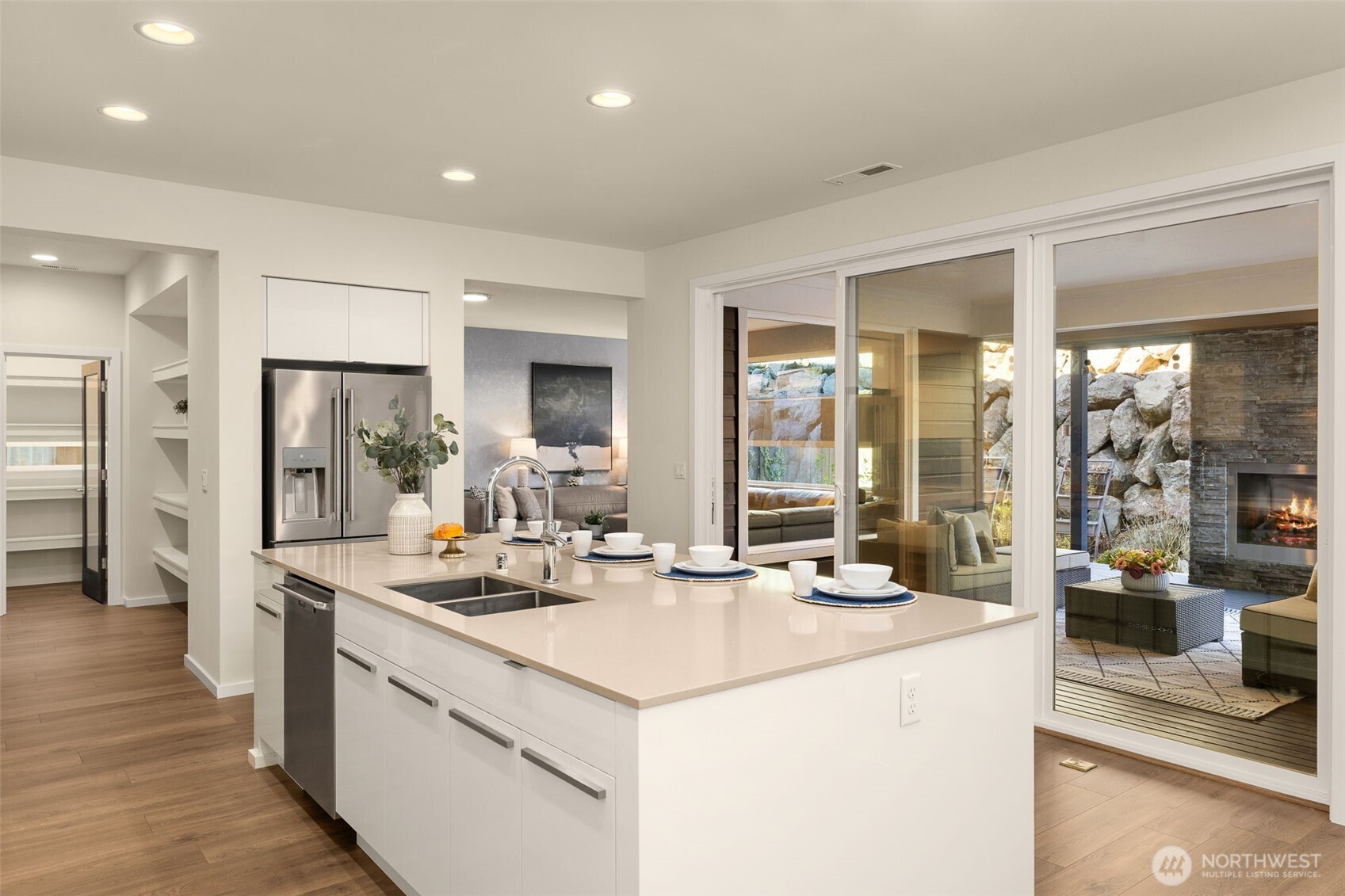 19387 135th Street Southeast Monroe, WA 98272 - Photo 14 of 40 a kitchen with stainless steel appliances kitchen island granite countertop a sink and a refrigerator