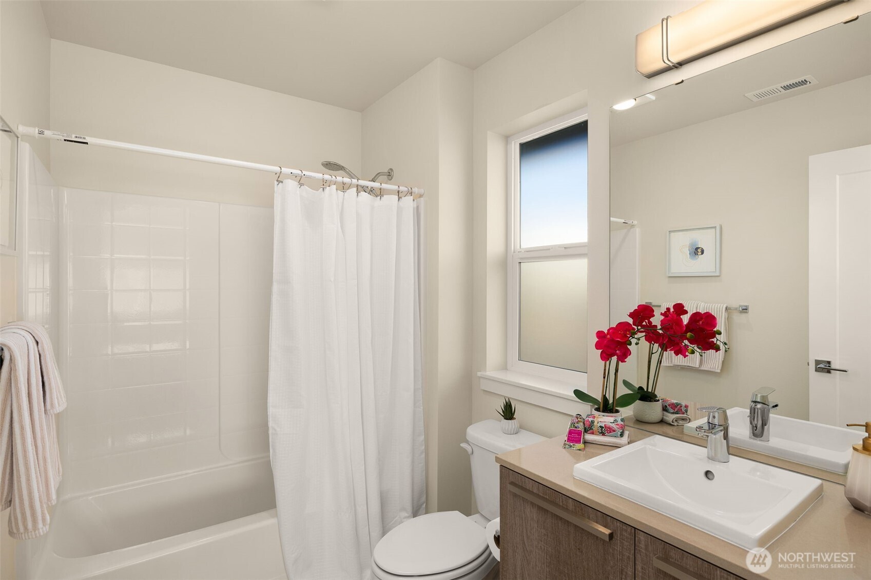 19387 135th Street Southeast Monroe, WA 98272 - Photo 27 of 40 a bathroom with a sink toilet and shower