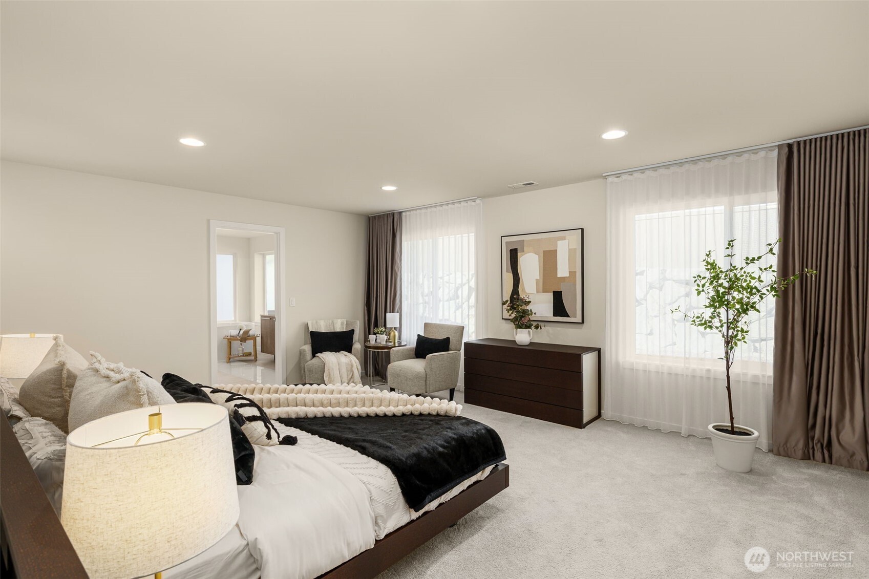 19387 135th Street Southeast Monroe, WA 98272 - Photo 29 of 40 a large bedroom with a large bed and a couch