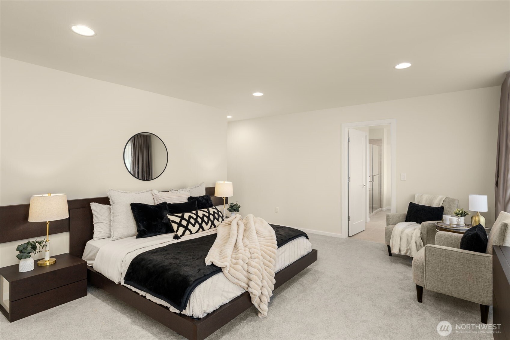 19387 135th Street Southeast Monroe, WA 98272 - Photo 30 of 40 a bedroom with bed and a chandelier