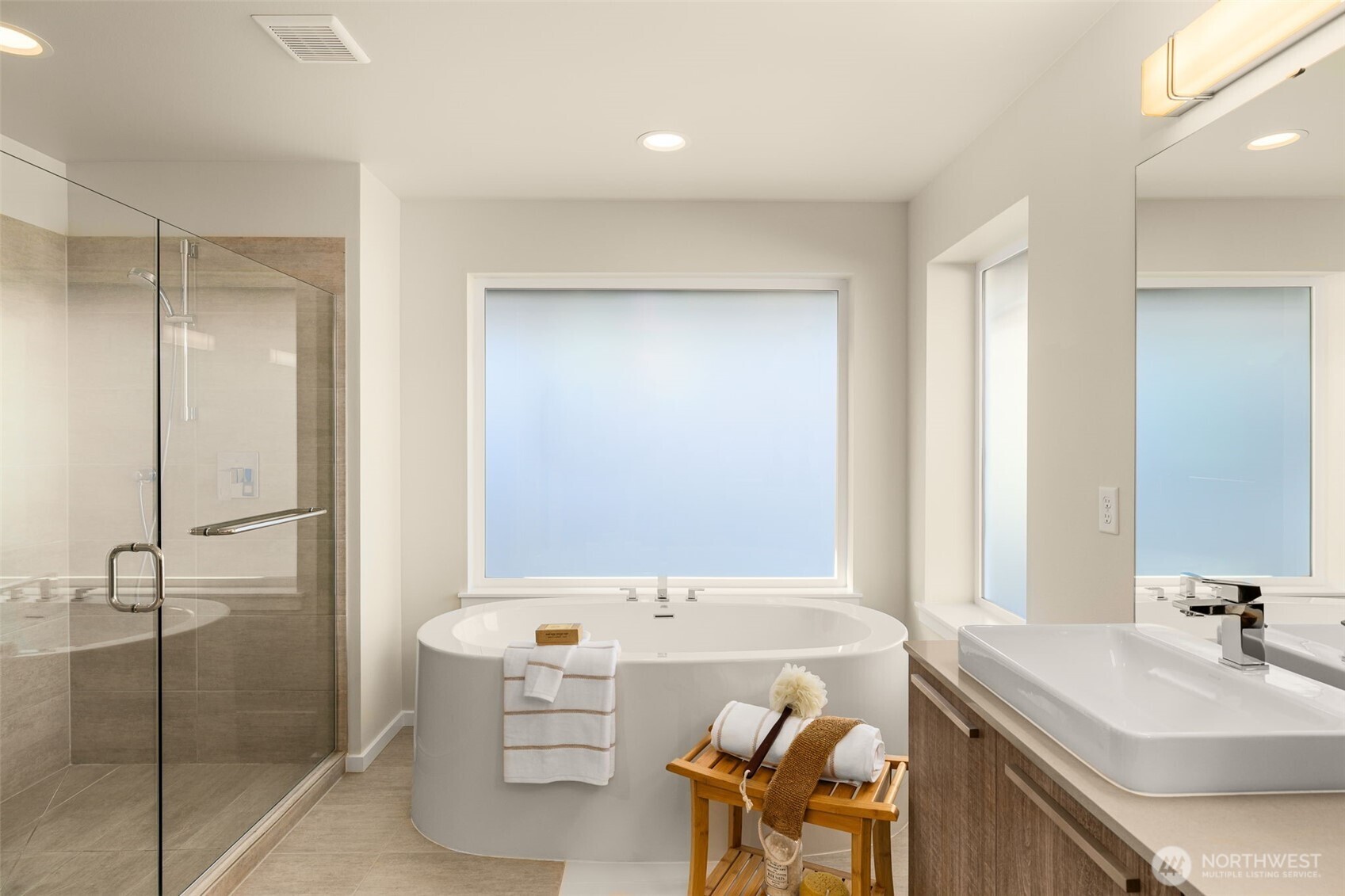 19387 135th Street Southeast Monroe, WA 98272 - Photo 32 of 40 a bathroom with a tub sink and mirror