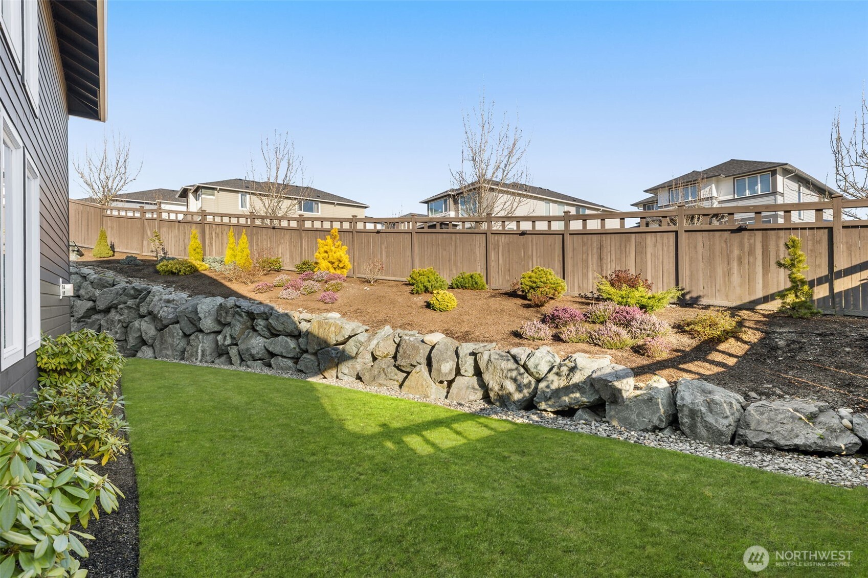 19387 135th Street Southeast Monroe, WA 98272 - Photo 36 of 40 a view of a house with garden and sitting area