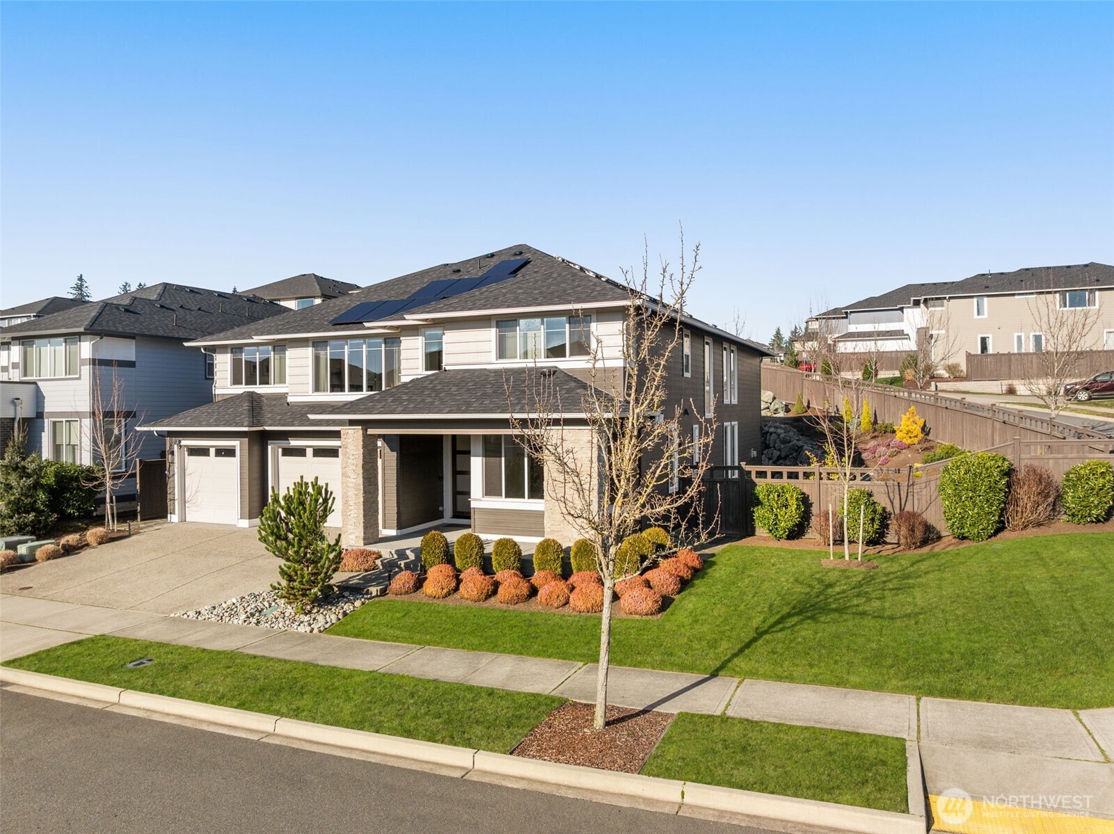 19387 135th Street Southeast Monroe, WA 98272 - Photo 37 of 40 a front view of a house with a garden and plants