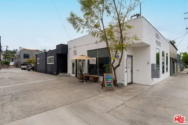 a view of a house with a snow on the road