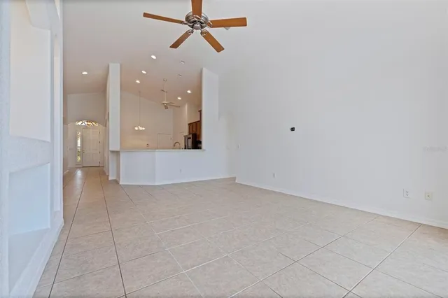 a view of a kitchen with a sink and cabinets