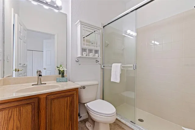 an empty room with windows and cabinet