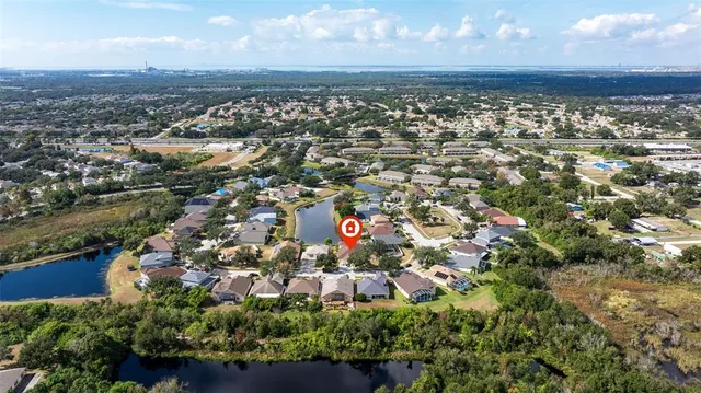 a street sign on a wall next to a building