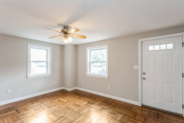 a view of an empty room with a window