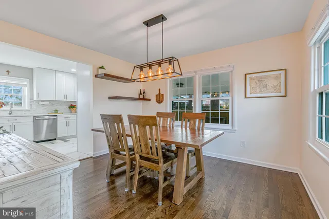 a kitchen with stainless steel appliances granite countertop a sink and a stove top oven