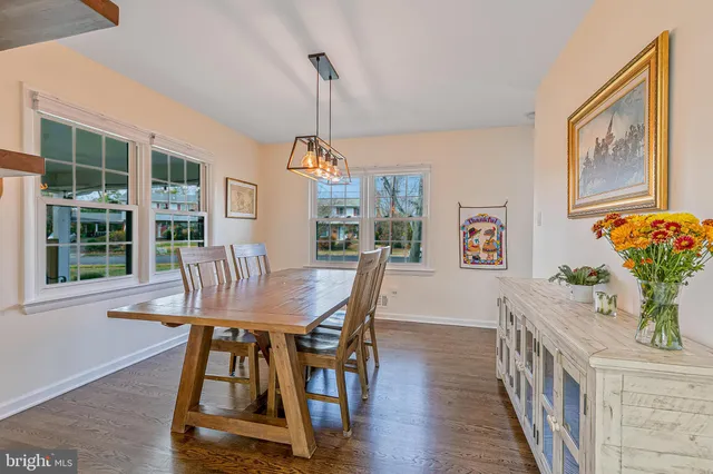 a bathroom with a granite countertop toilet a sink and a bathtub