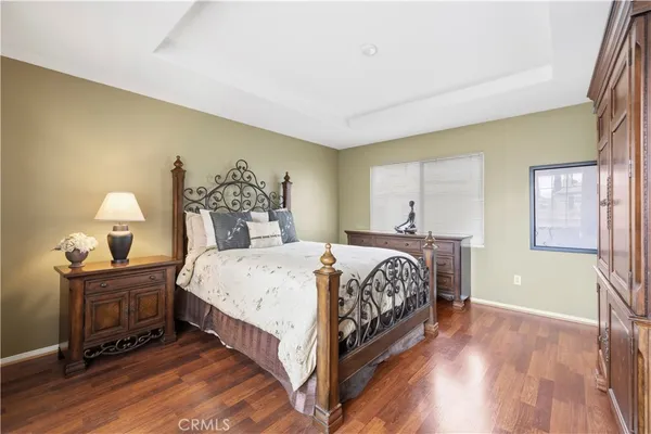 a bedroom with bed and window
