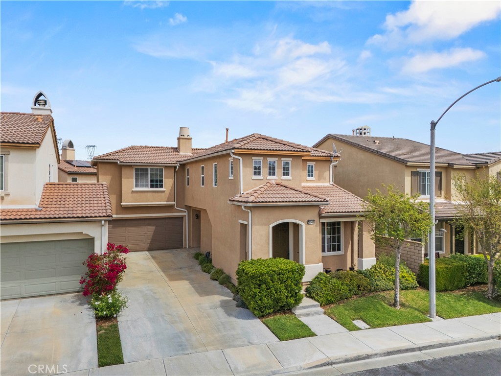 28940 Mirada Circulo Valencia, CA 91354 - Photo 2 of 25 a large white house with a yard and potted plants