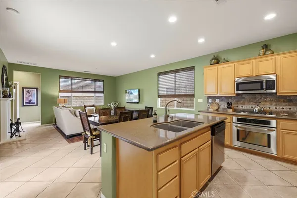 a kitchen with sink cabinets and microwave