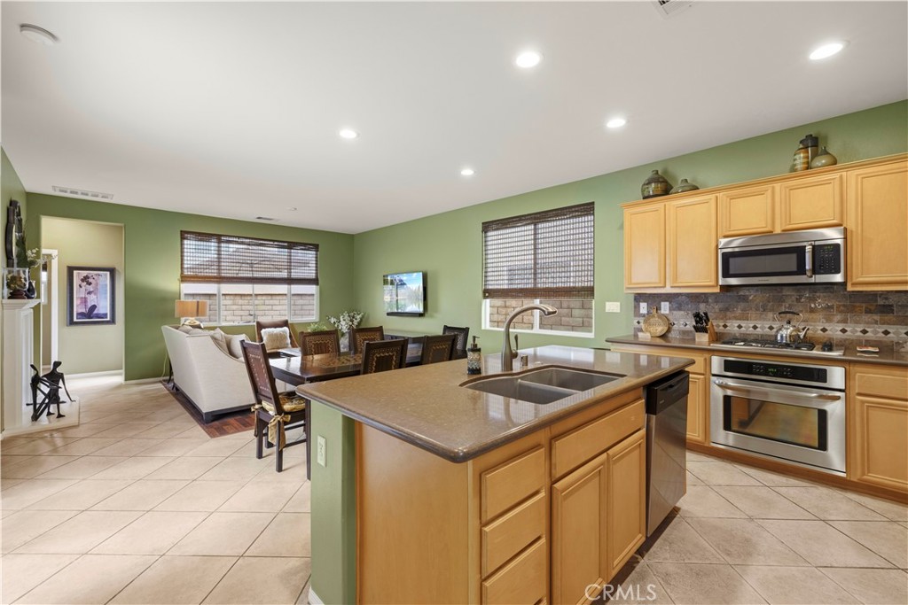 28940 Mirada Circulo Valencia, CA 91354 - Photo 6 of 25 a kitchen with sink cabinets and microwave
