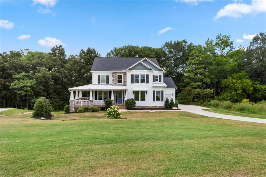 1585 Dabbs Bridge Road Dallas, GA 30132 - Photo 1 of 32 a view of a house with a big yard