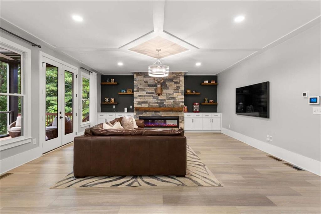 1585 Dabbs Bridge Road Dallas, GA 30132 - Photo 11 of 32 a living room with furniture and a flat screen tv