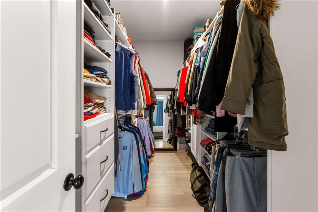 1585 Dabbs Bridge Road Dallas, GA 30132 - Photo 18 of 32 a view of walk in closet with clothes