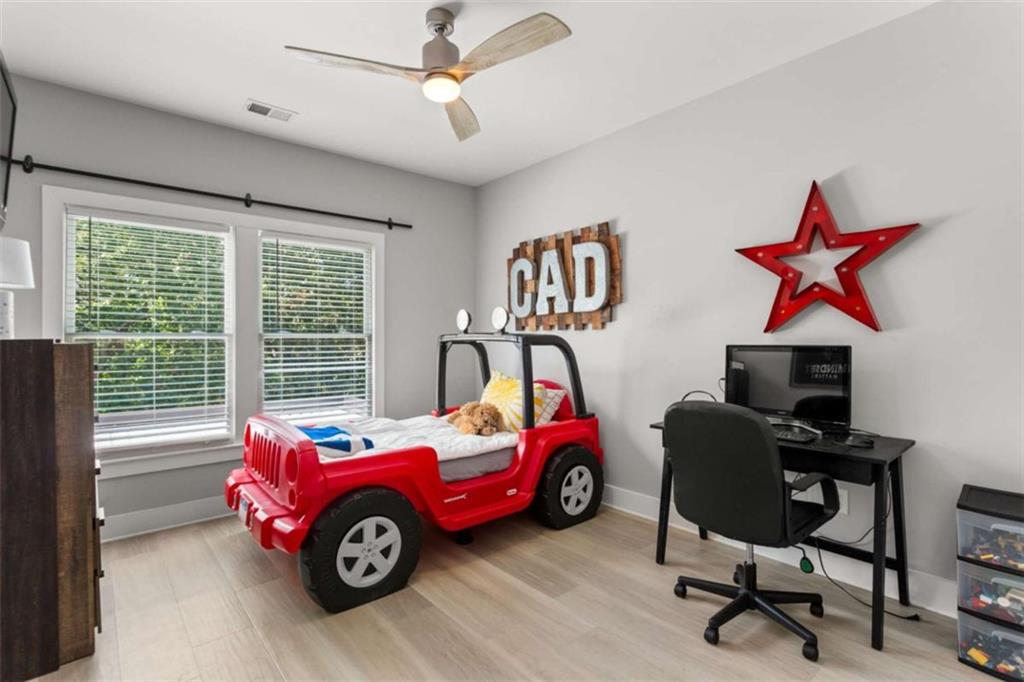 1585 Dabbs Bridge Road Dallas, GA 30132 - Photo 21 of 32 a car is parked in a room next to a window