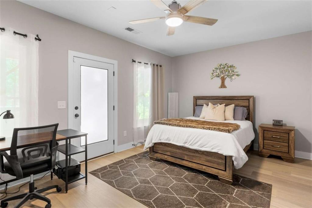 1585 Dabbs Bridge Road Dallas, GA 30132 - Photo 28 of 32 a bedroom with a bed and chair