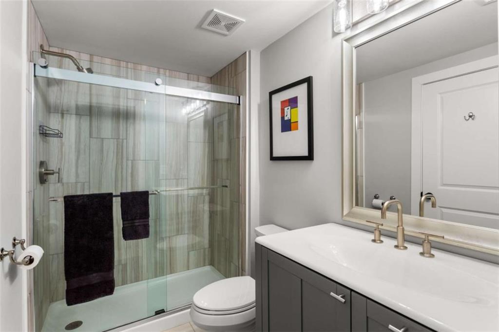 1585 Dabbs Bridge Road Dallas, GA 30132 - Photo 29 of 32 a bathroom with a sink a toilet and shower