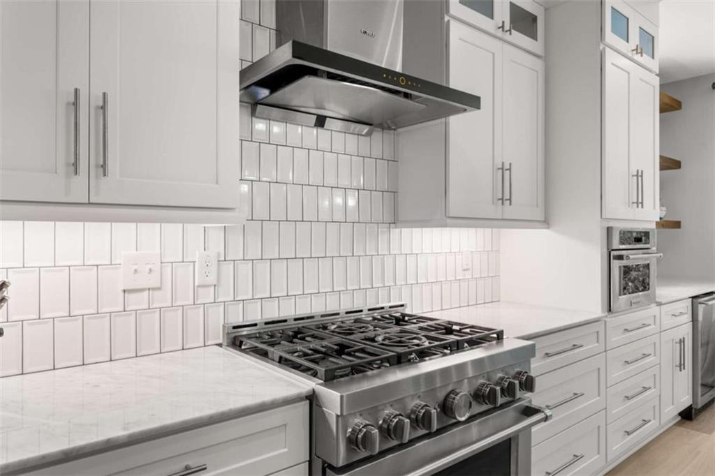 1585 Dabbs Bridge Road Dallas, GA 30132 - Photo 7 of 32 a stove top oven sitting inside of a kitchen