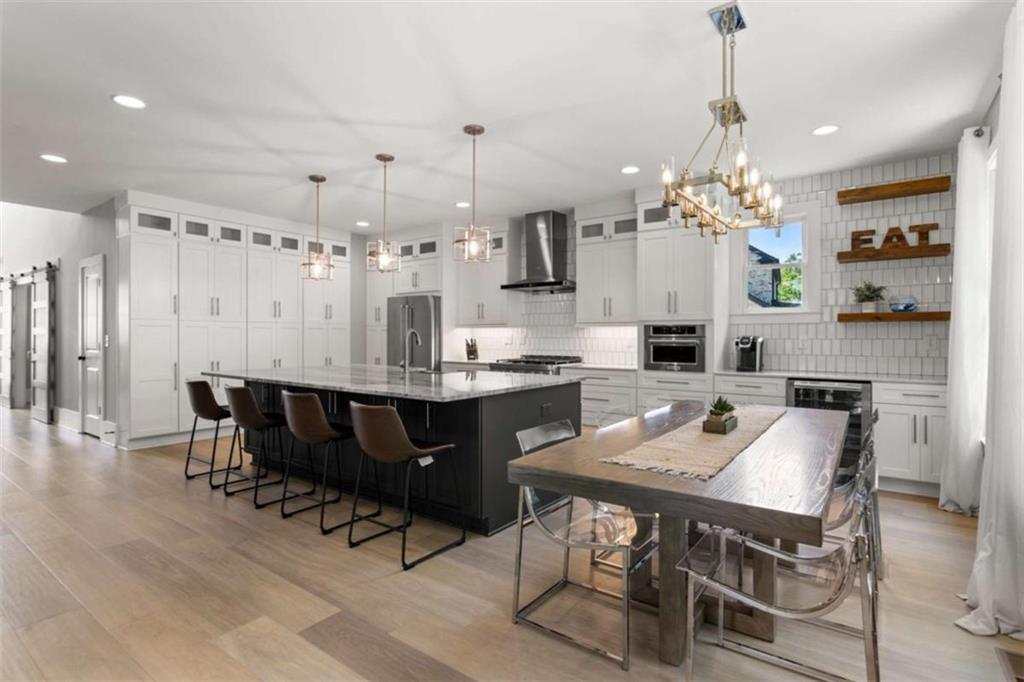 1585 Dabbs Bridge Road Dallas, GA 30132 - Photo 10 of 32 a large kitchen with a table and chairs