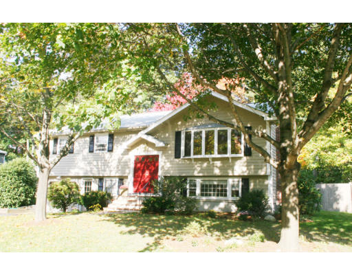 36 Hemlock Road Reading, MA 01867 - Photo 1 of 14 a front view of a house with a yard