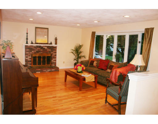 36 Hemlock Road Reading, MA 01867 - Photo 2 of 14 a living room with furniture and a fireplace