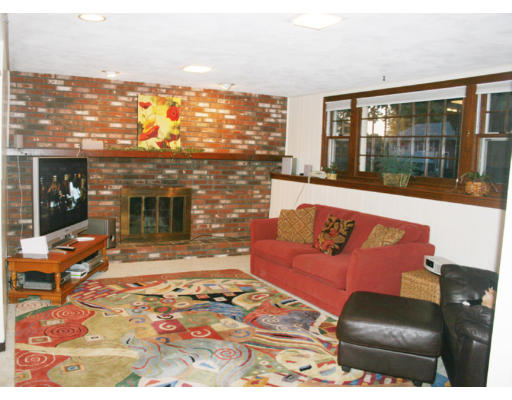 36 Hemlock Road Reading, MA 01867 - Photo 5 of 14 a living room with furniture and a fireplace