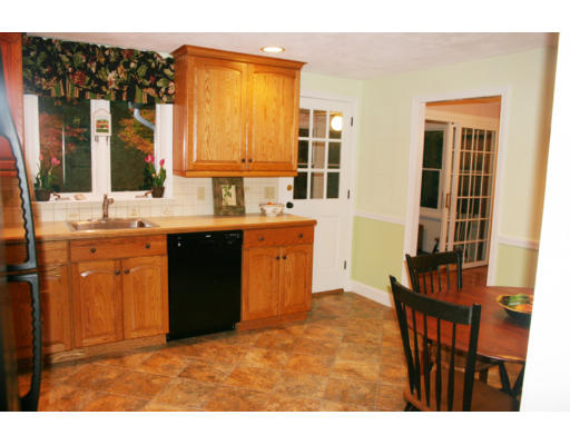 36 Hemlock Road Reading, MA 01867 - Photo 9 of 14 a kitchen with a sink stove and cabinets