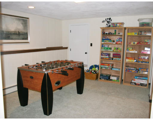 36 Hemlock Road Reading, MA 01867 - Photo 10 of 14 a bed room with a bed and a book shelf