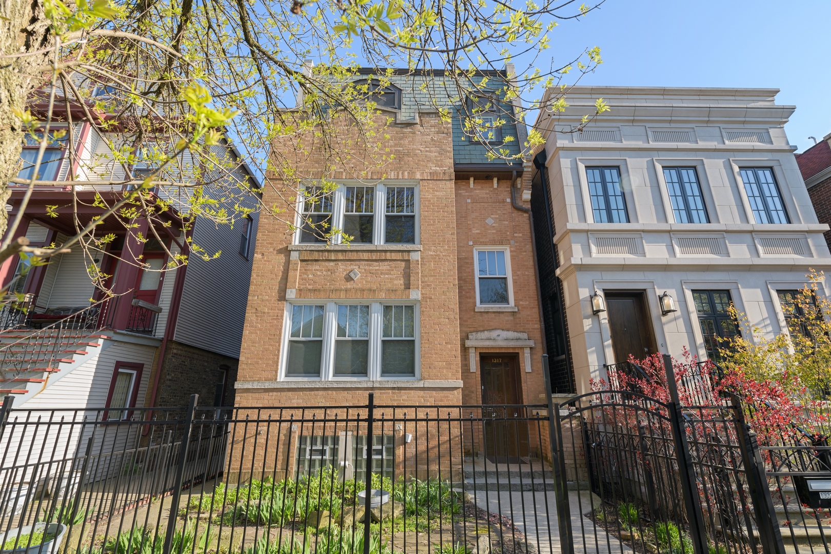 a view of a brick building with many windows