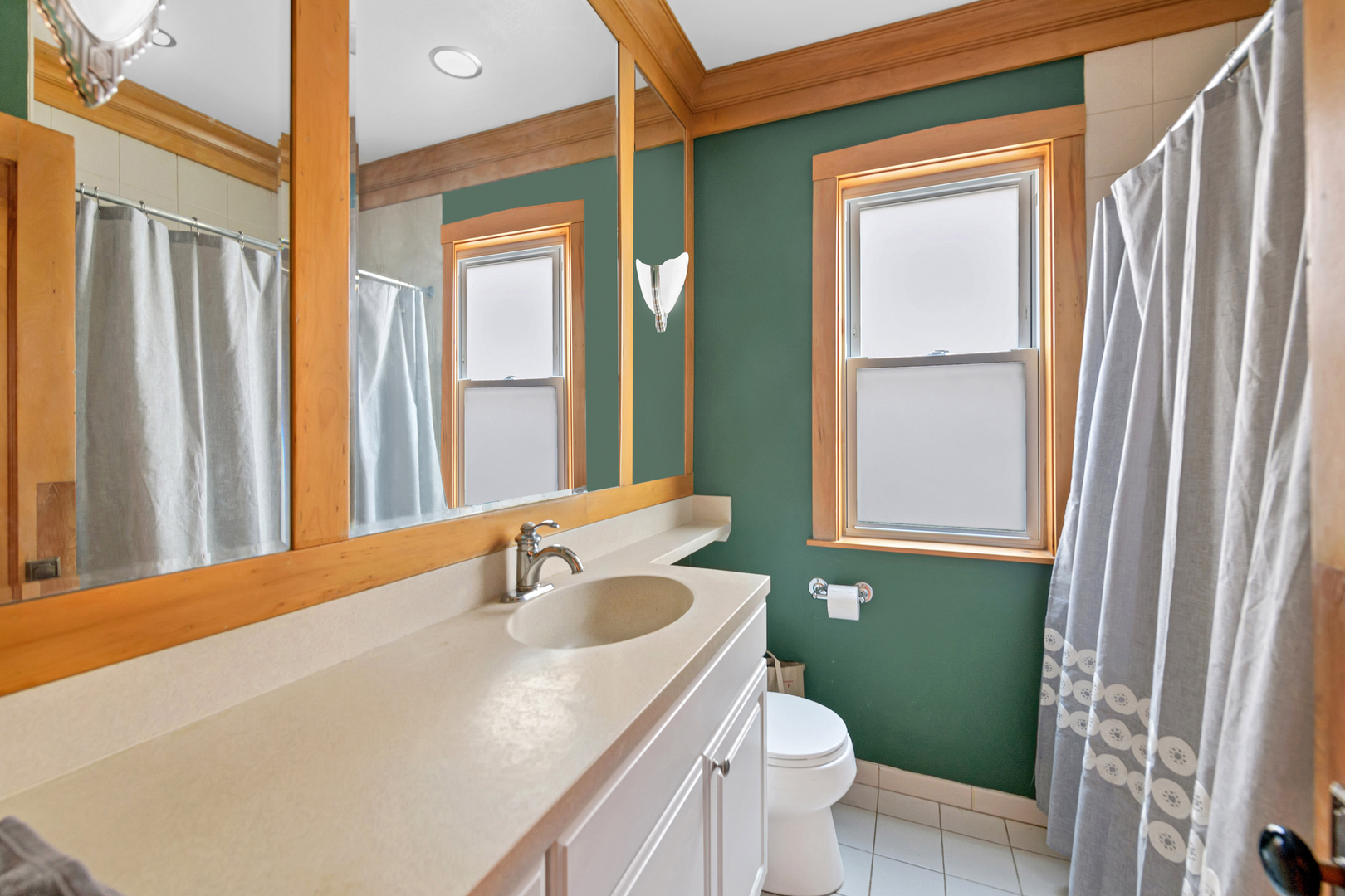 Undisclosed Address Chicago, IL 60657 - Photo 12 of 18 a bathroom with a sink a toilet and a mirror