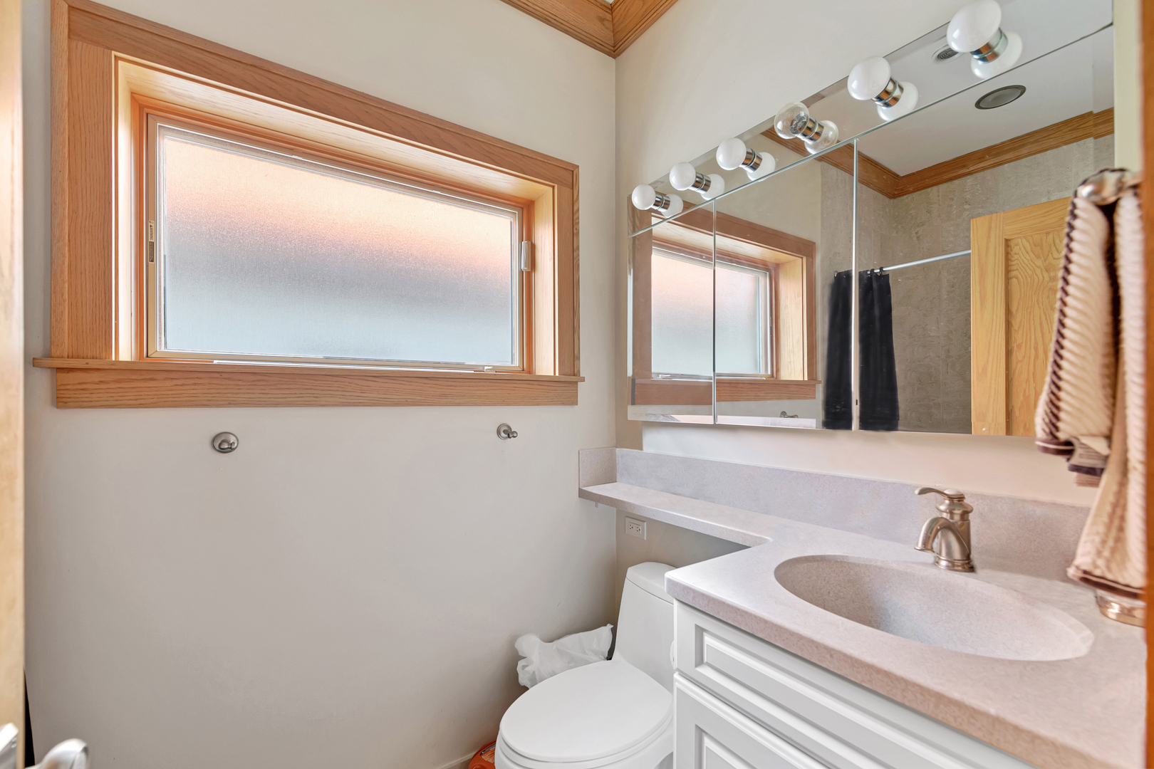 Undisclosed Address Chicago, IL 60657 - Photo 14 of 18 a bathroom with a sink toilet and mirror