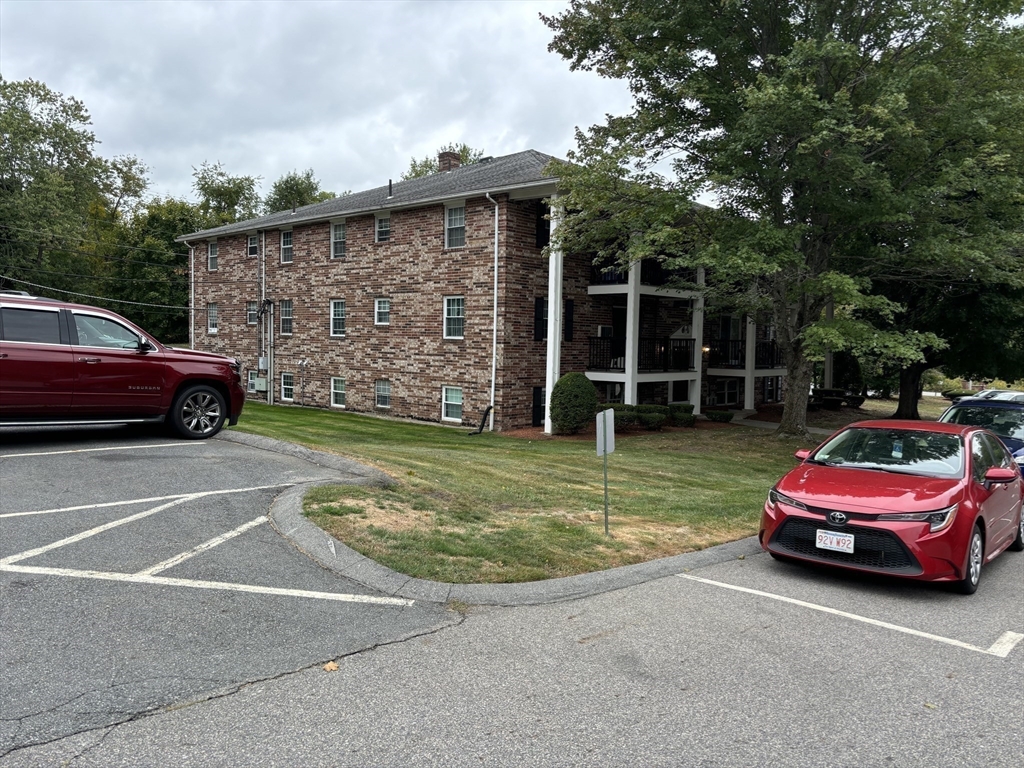 1 Walker Road, Unit 3 North Andover, MA 01845 - Photo 6 of 13 a front view of a house with a garden