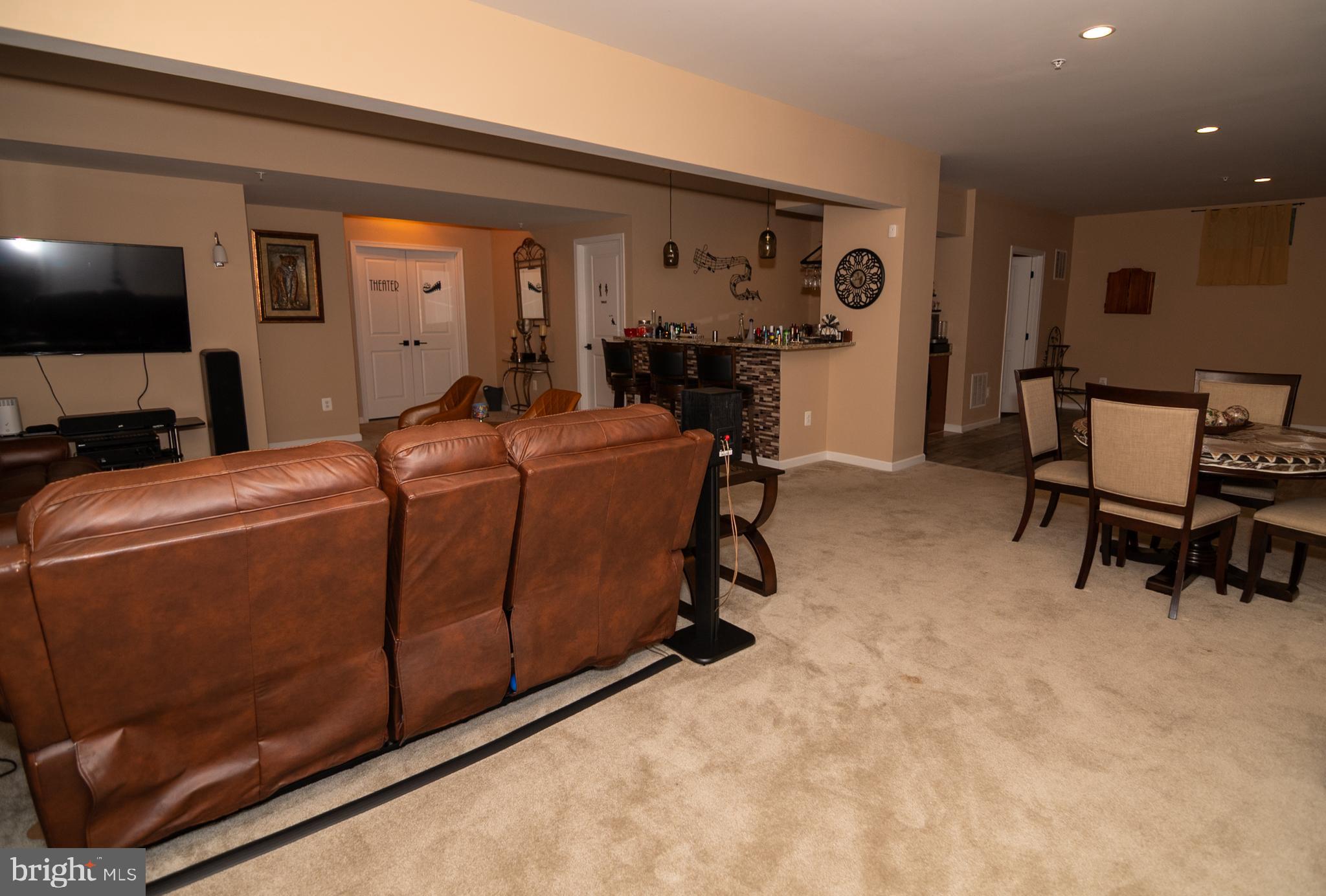 11013 Jumping Way Upper Marlboro, MD 20772 - Photo 19 of 51 a room with furniture and a flat screen tv