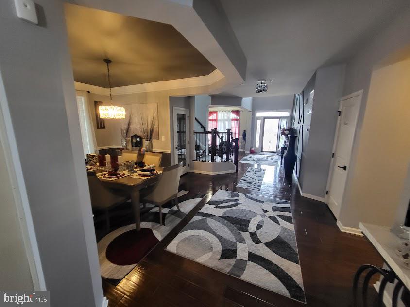 11013 Jumping Way Upper Marlboro, MD 20772 - Photo 44 of 51 a view of a dining room with furniture and chandelier