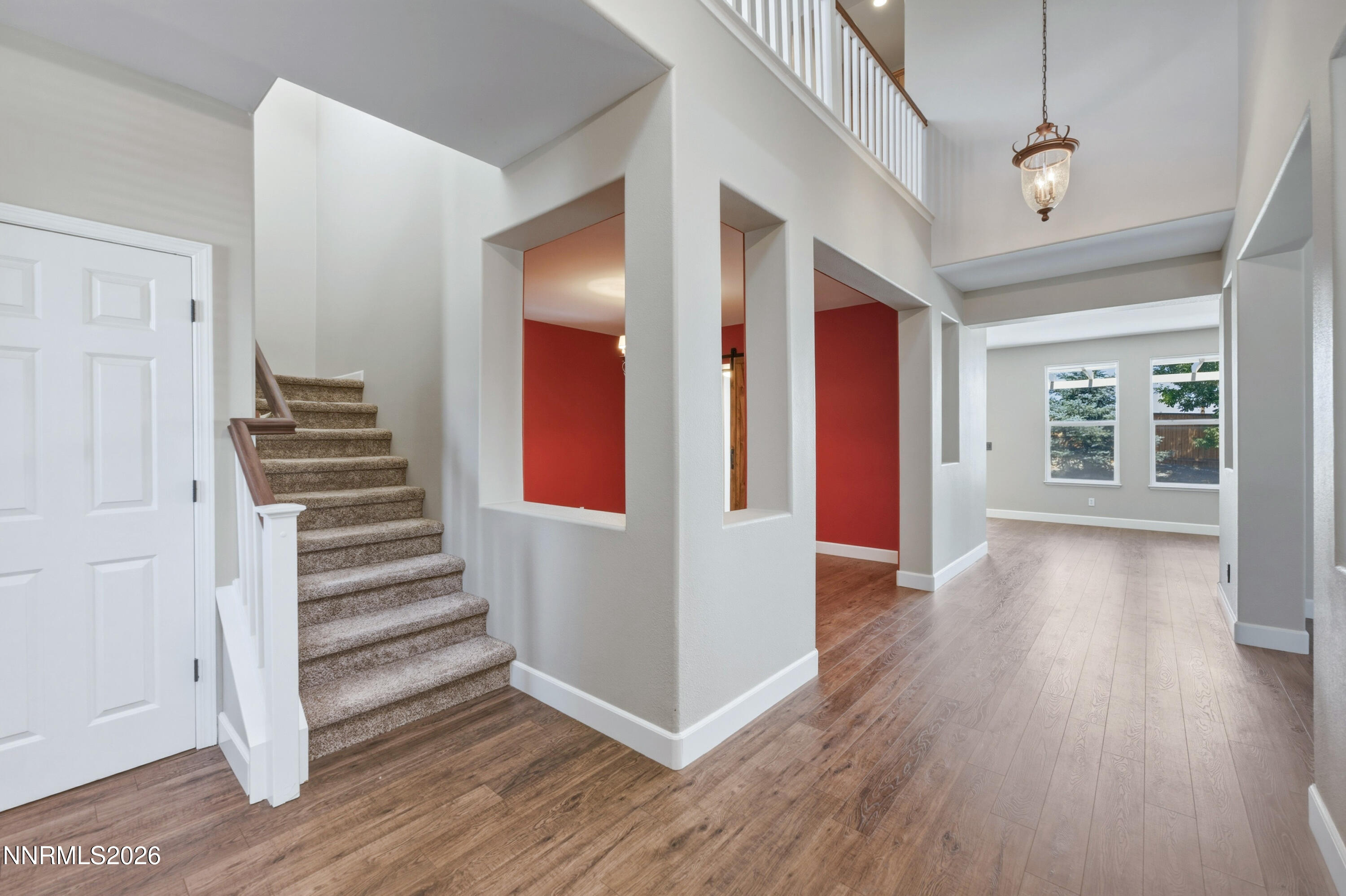 1770 Kodiak Circle Reno, NV 89511 - Photo 14 of 32 a view of a hallway with wooden floor and stairs