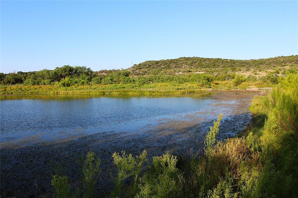 T3 Hwy 208 Robert Lee Tx 76945 Robert Lee, TX 76945 - Photo 12 of 15 a view of a lake with a mountain in the background