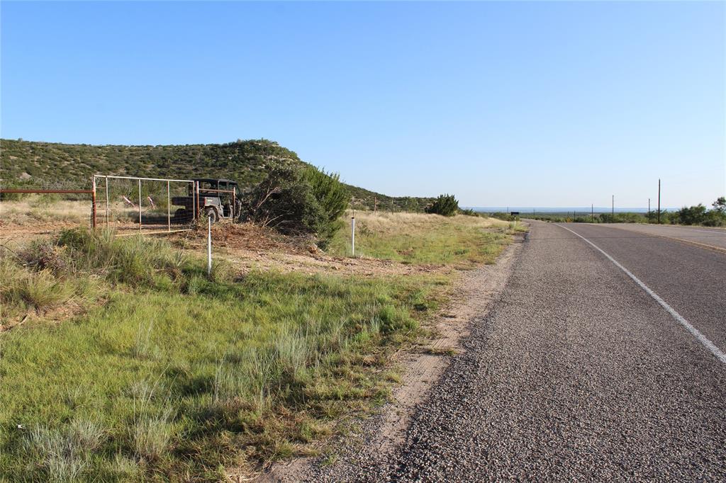 T3 Hwy 208 Robert Lee Tx 76945 Robert Lee, TX 76945 - Photo 14 of 15 a view of a dry yard with wooden fence