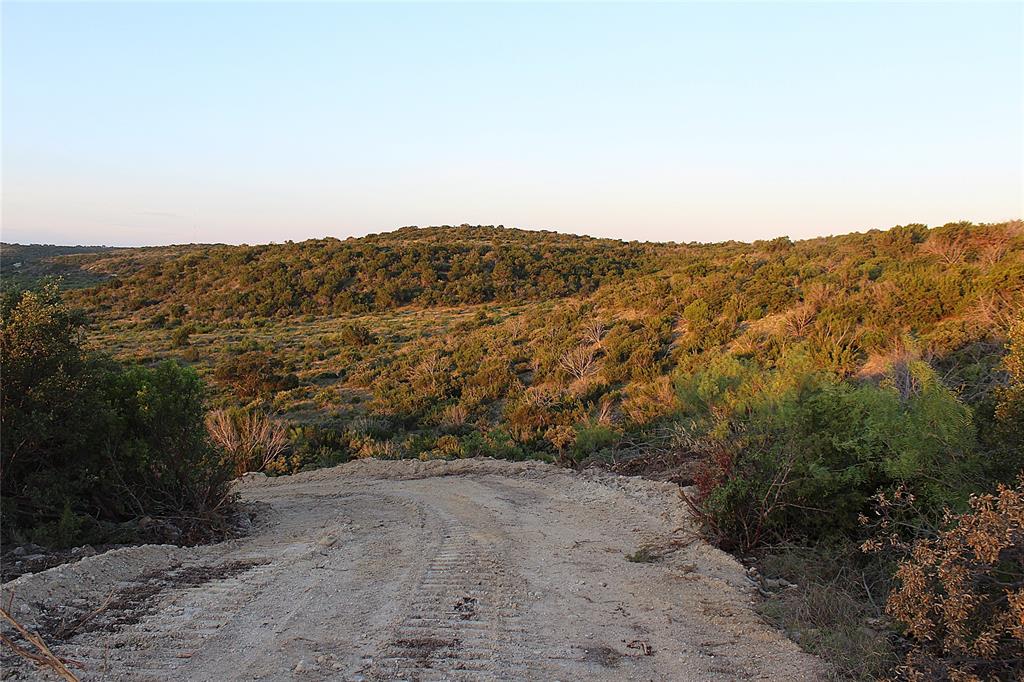 T3 Hwy 208 Robert Lee Tx 76945 Robert Lee, TX 76945 - Photo 10 of 15 a view of a dry yard with mountains in the background